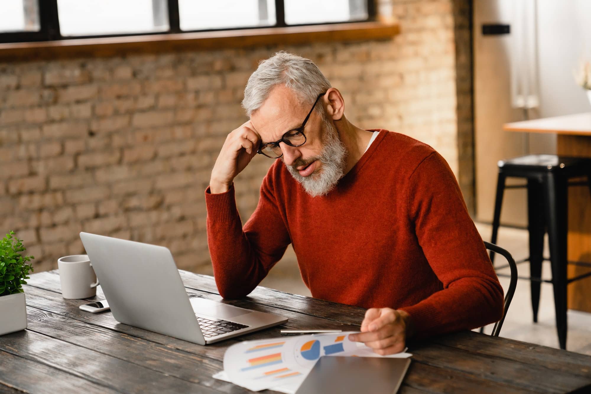 Businessman having problems while doing paperwork, deadline, overworked, bankruptcy concept.